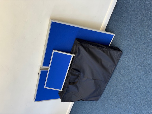Display boards before setup. 6 panels folding 900 x 600mm with header panel.
