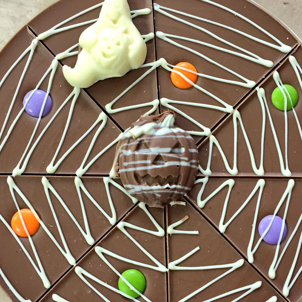 Each Halloween Pizza has white chocolate cobwebs and a selection of halloween-themed solid chocolate shapes